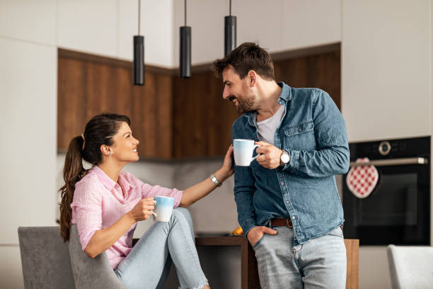 istock Happy young couple in kitchen 1474006347
