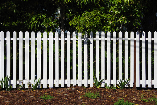 A white wooden picket fence