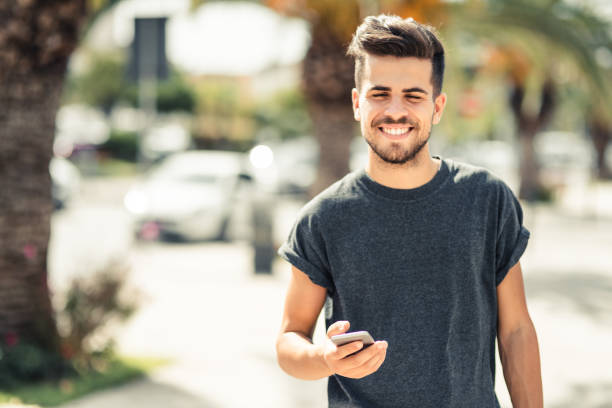 istock young man after jogging resting on the wall 1474009138
