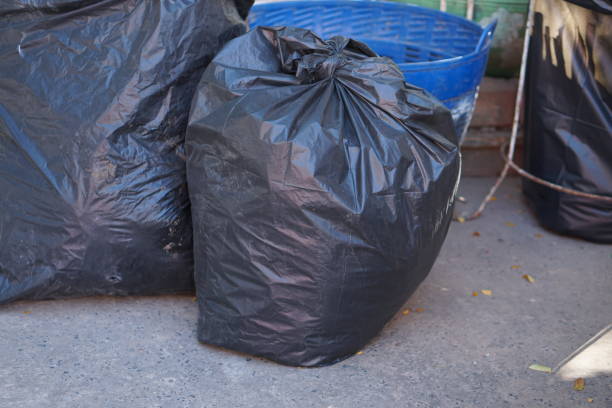 istock black garbage bags in the park 1474010437