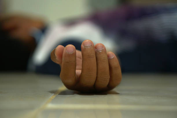 istock Male hand lost consciousness from falling in house 1474010834