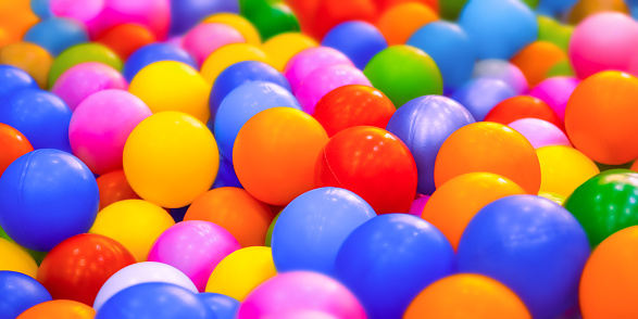 Many colorful balls background playground balls pool plastic. Dry pool or kids ball pit. Entertainment banner kids play zone or kids zone. Kindergarten playground indoor play area. leisure. Playroom