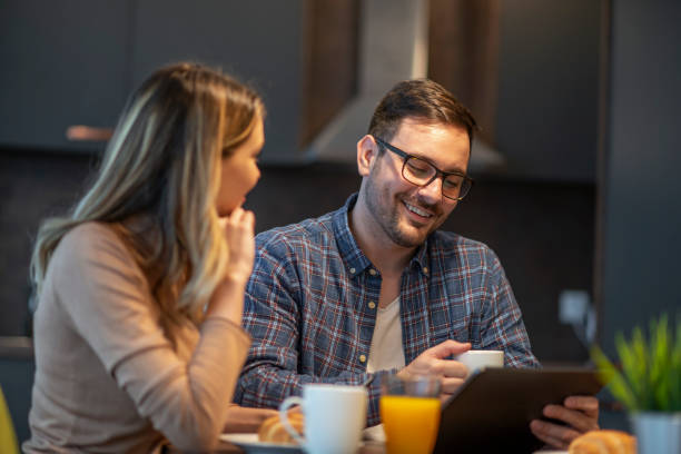 istock Loving couple working from home 1474012301