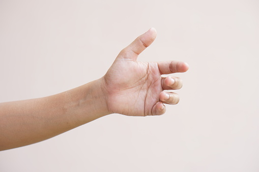 Asian woman making hands like holding an empty bottle