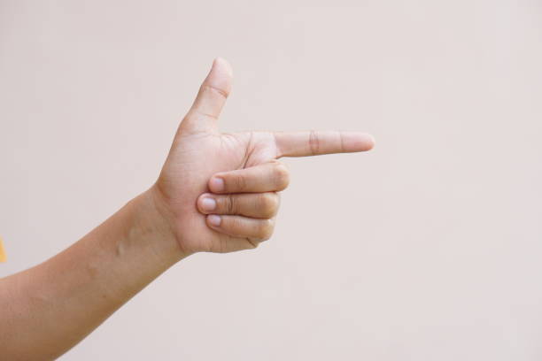 istock Asian woman pointing finger forward 1474013594