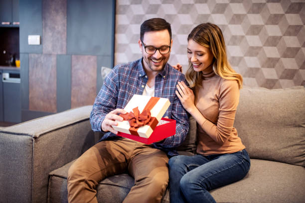 istock Beautiful young couple is celebrating at home. 1474013602