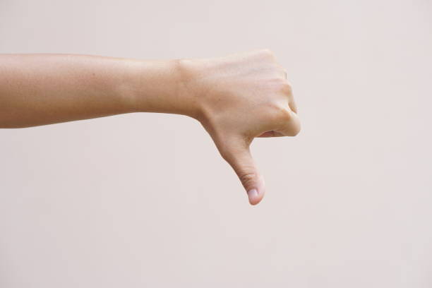 istock Asian woman making hand dislike sign 1474013618