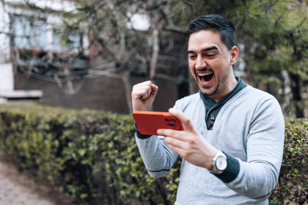 istock Passionate sports fan watching a stream 1474015592