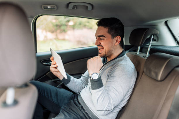 istock Man cheerfully waving his fist while watching a stream 1474015811