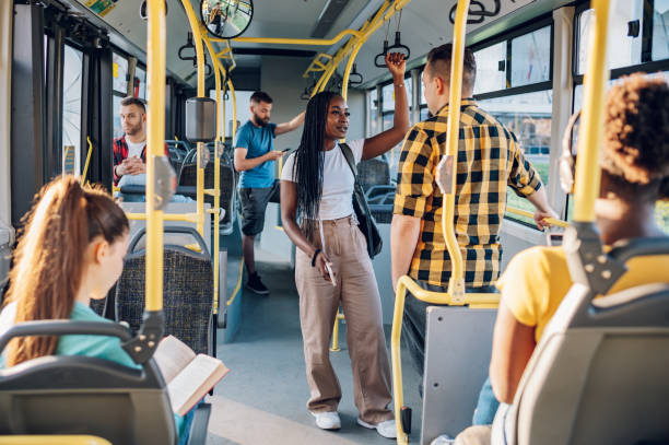 istock Multiracial friends talking while riding a bus in the city 1474019348