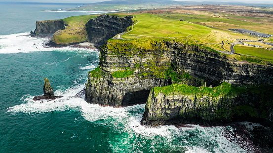 The Cliffs of Moher are sea cliffs located at the southwestern edge of the Burren region in County Clare, Ireland. The cliffs rank among the most visited tourist sites in Ireland, with around 1.5 million visits per year.