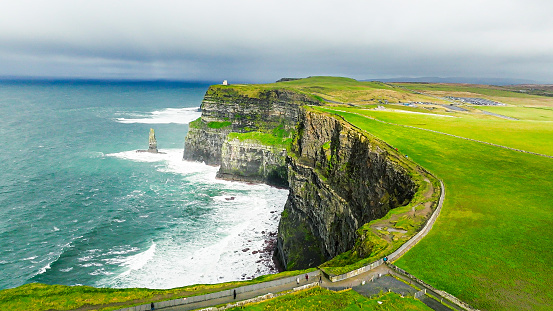 The Cliffs of Moher are sea cliffs located at the southwestern edge of the Burren region in County Clare, Ireland. The cliffs rank among the most visited tourist sites in Ireland, with around 1.5 million visits per year.