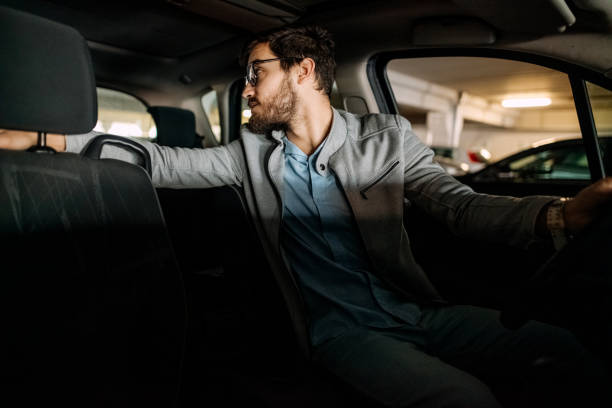 istock Young man in the car 1474025273