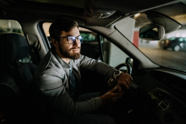 istock Young man in the car 1474025317