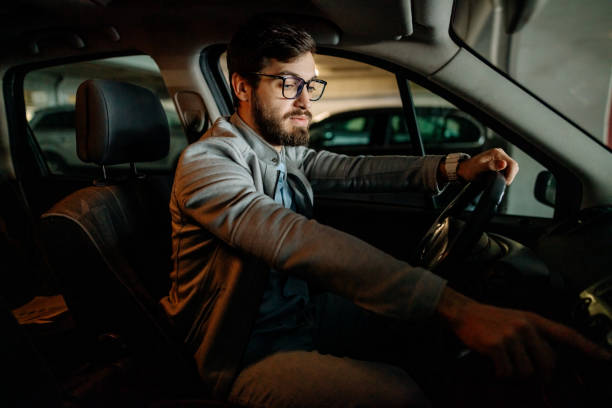 istock Young man in the car 1474025318