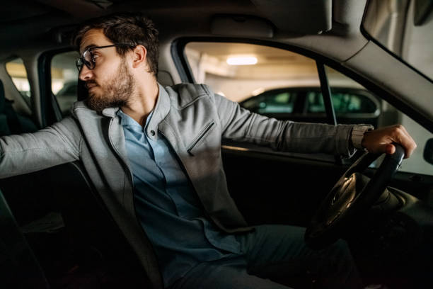 istock Young man in the car 1474025400