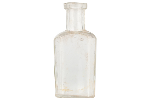 Small vintage aquamarine colour medicine  bottle isolated with a white background