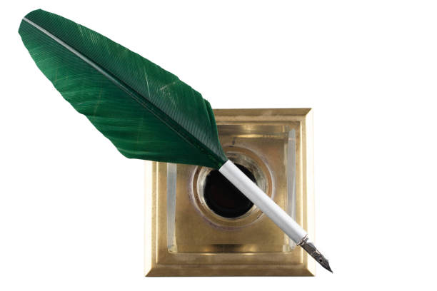 istock Old vintage feather quill with glass inkwell 1474027788