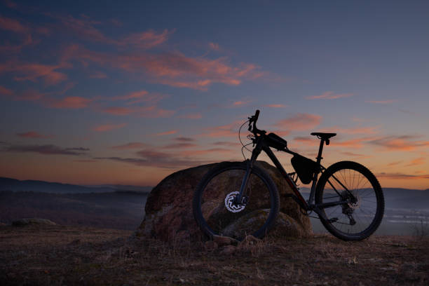 istock Outdoor workout. Mountain bike at sunset.. 1474028547