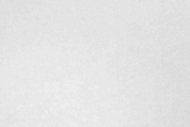 istock White recycled craft paper texture as background. Grey paper texture material, Old vintage page light wrinkle tone vignette of old newspaper and journal blank. Paperwork pattern letter for text. 1474028596