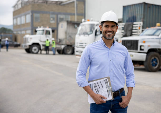 istock Happy foreperson working at a distribution warehouse 1474044045