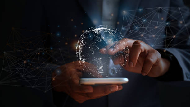 istock Young businessman in suit using smartphone, global big data connection concept through virtual technology analyzing economic market data to cover regions 1474046056