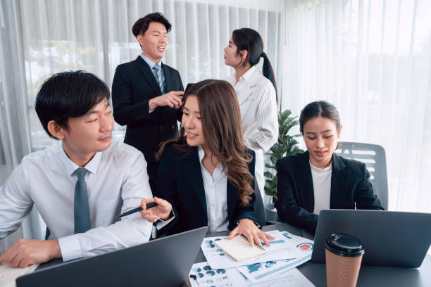 istock Office worker and manager analyze financial report paper in harmony workplace. 1474051149