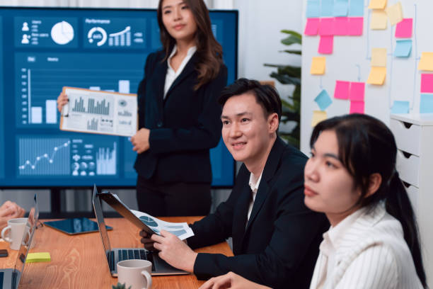 istock Businesswoman give presentation on dashboard data on screen at harmony office. 1474051574