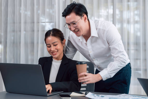 istock Manager with coffee advice colleagues as concept of harmony in office. 1474052849
