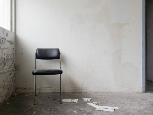 istock Chair in a deserted room 1474053635