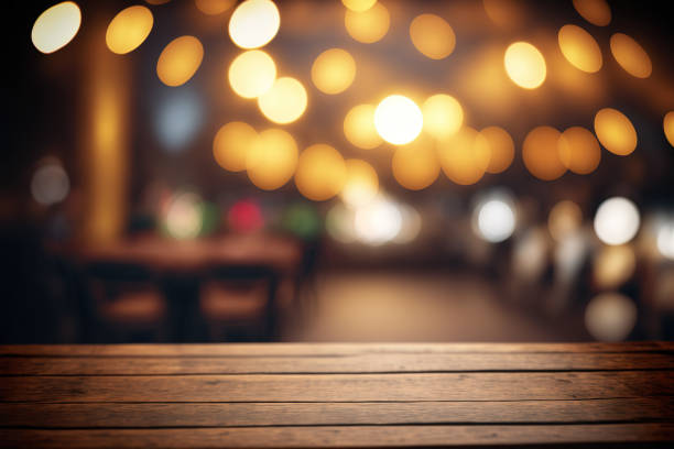 istock Empty wood table for product display in blur background of restaurant at night 1474054812