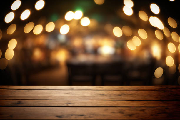 istock Empty wood table for product display in blur background of restaurant at night 1474054823