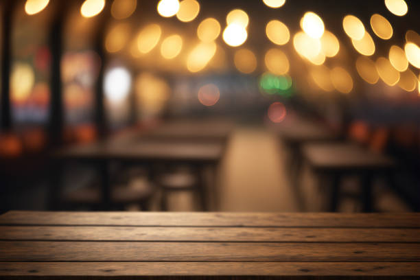 istock Empty wood table for product display in blur background of restaurant at night 1474054849