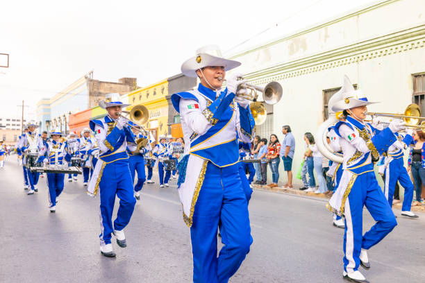 Matamoros, Tamaulipas, Mexico - February 25, 2023: Fiestas Mexicanas Parade, Members of the Toros Marching band from the Juan Jose de la Garza High School performing at the parade