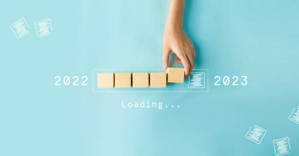 istock Hand putting wooden cube for countdown to 2022. Loading year from 2022 to 2023. New year start concept 1474062496