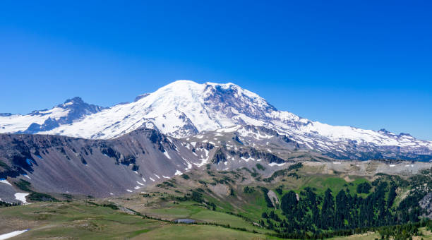 istock Snow Mountain and Green Forest 1474062518