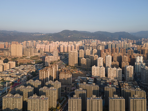 An aerial view of dense modern urban buildings in the morning