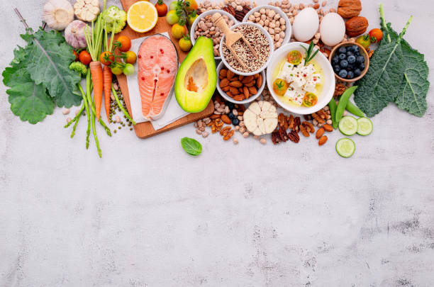istock Ketogenic low carbs diet concept. Ingredients for healthy foods selection set up on white concrete background. 1474064527