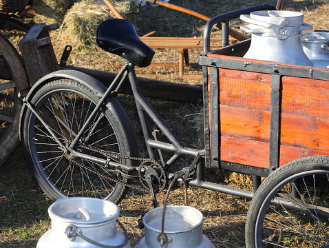 old bike used by the milkman to transport the milk cans to the families