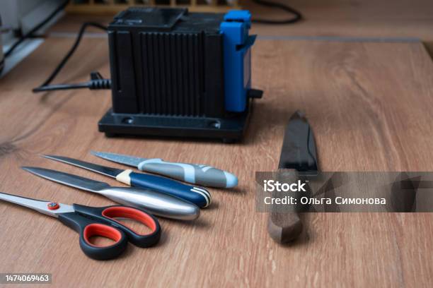 Sharpening A Knife On An Electric Sharpener At Home Flatlay Knife Blade Scissors  Sharpeners Dust Flies On The Machine Stock Photo - Download Image Now -  iStock