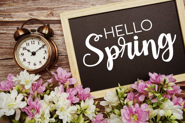 istock Hello Spring typography text written on wooden blackboard with flower bouquet decorate on wooden background 1474071997