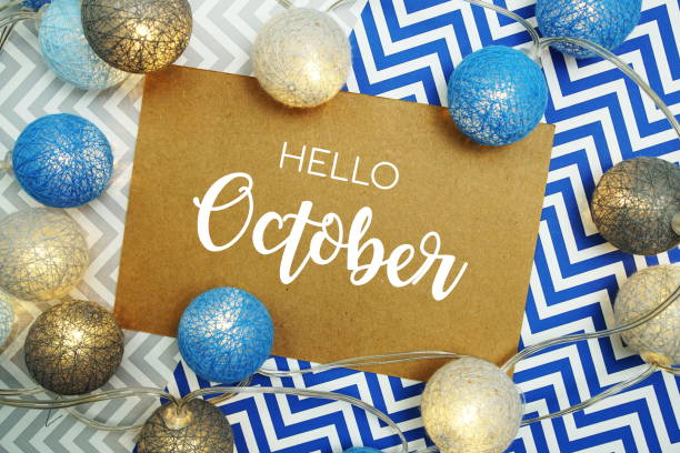 istock Hello October typography text on paper card with LED cotton balls decoration 1474072188