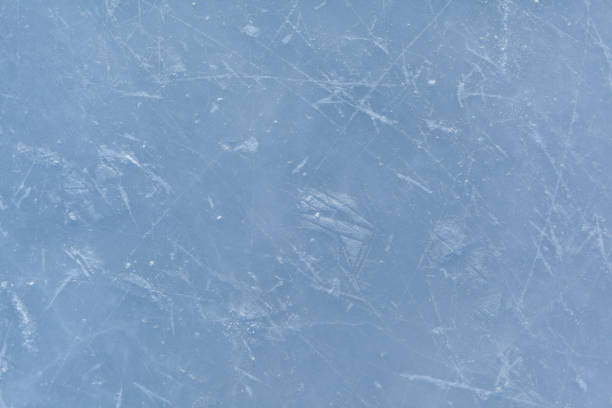 istock Empty ice rink with skate marks after the session outdoor. 1474076853