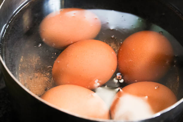 istock Chicken eggs being boiled in a pot with water 1474082129
