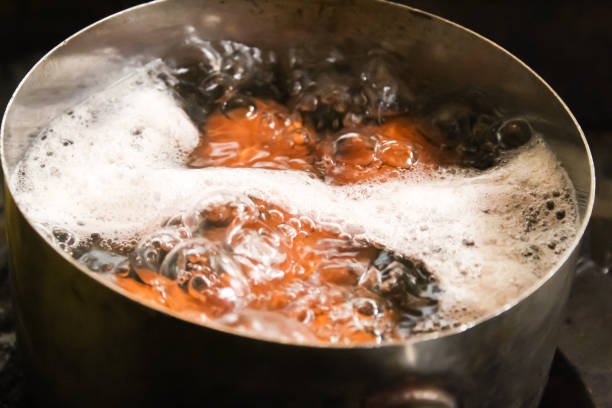 istock Chicken eggs boiled in a pot with boiling water 1474082468