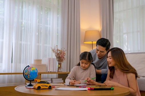 Family with one daughter at home. Family activity at home concept.