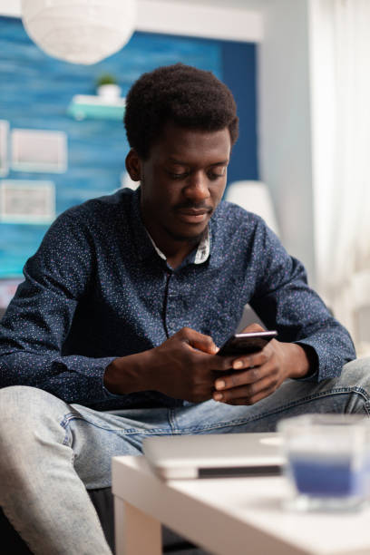 istock African american man browsing on social media using smartphone 1474089965