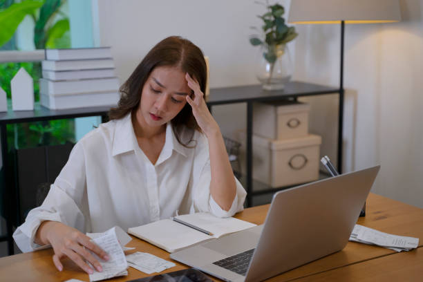 Young woman has financial problem at home. stock photo