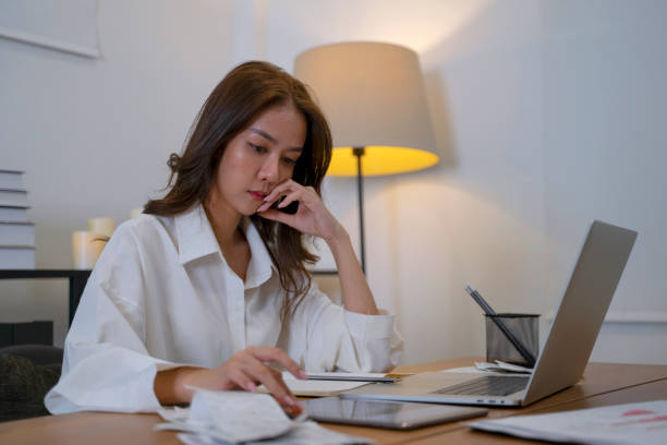 istock Young woman has financial problem at home. 1474091494