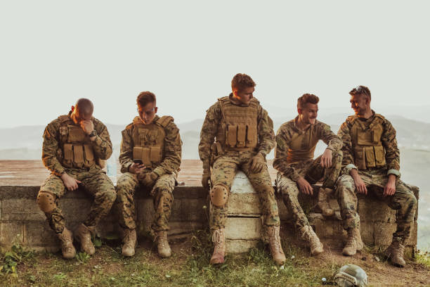 istock Soldiers squad relaxing after battle having a break on training 1474094115